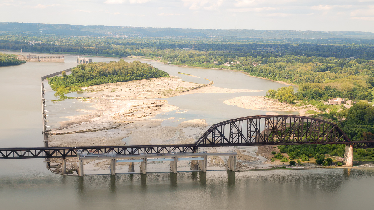 Aerial view of dams diverting the river around rocky islands