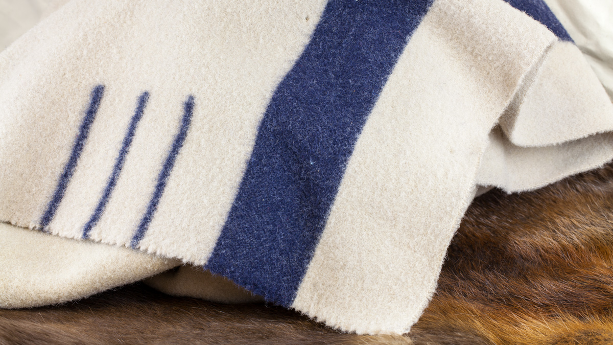 Gray blanket with one navy stripe