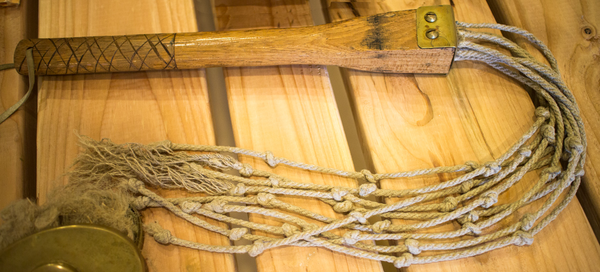 knotty ropes tied to a stick meant for whipping