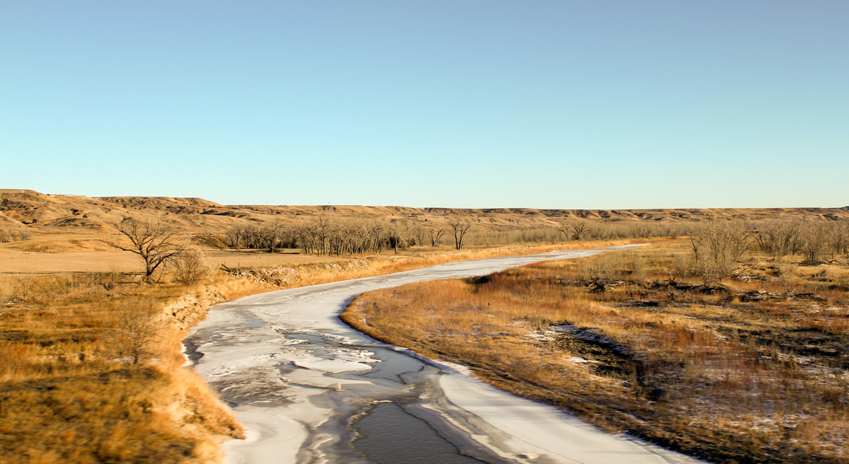 The Cheyenne river flows through a South Dakota valley