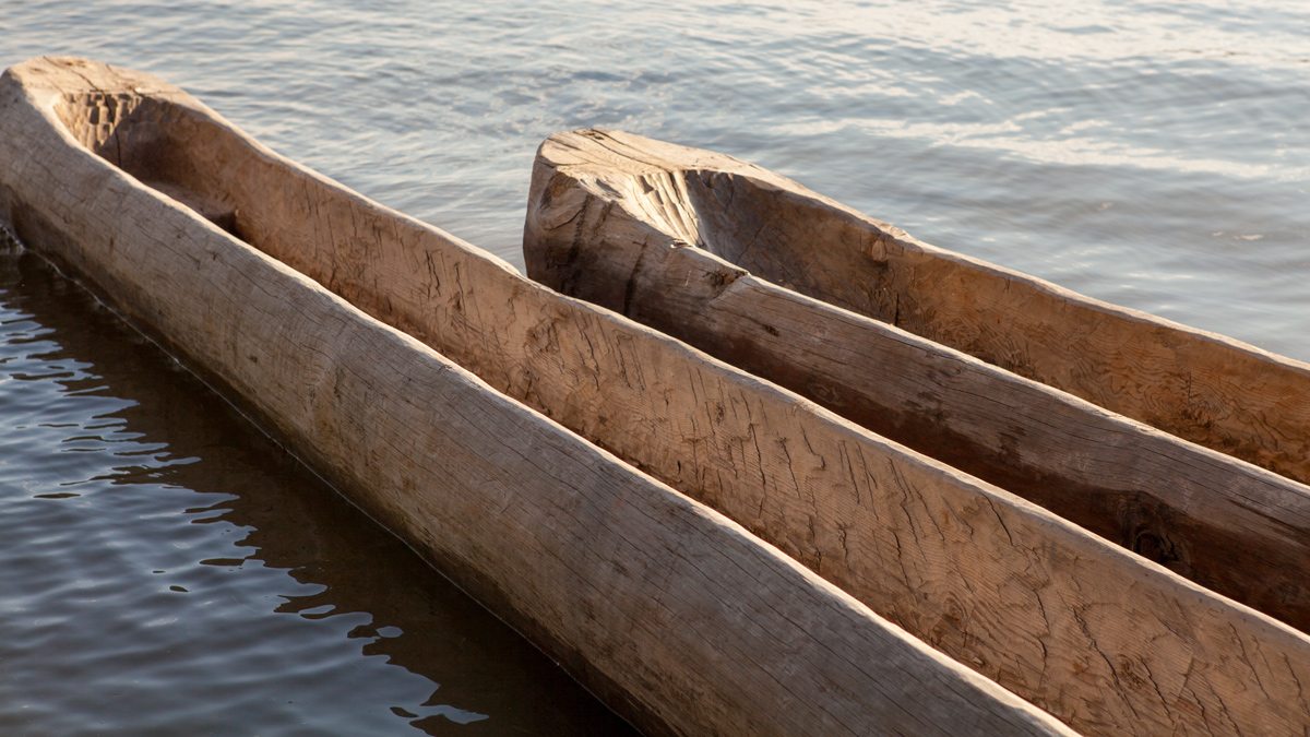 Two small dugout canoes in the water