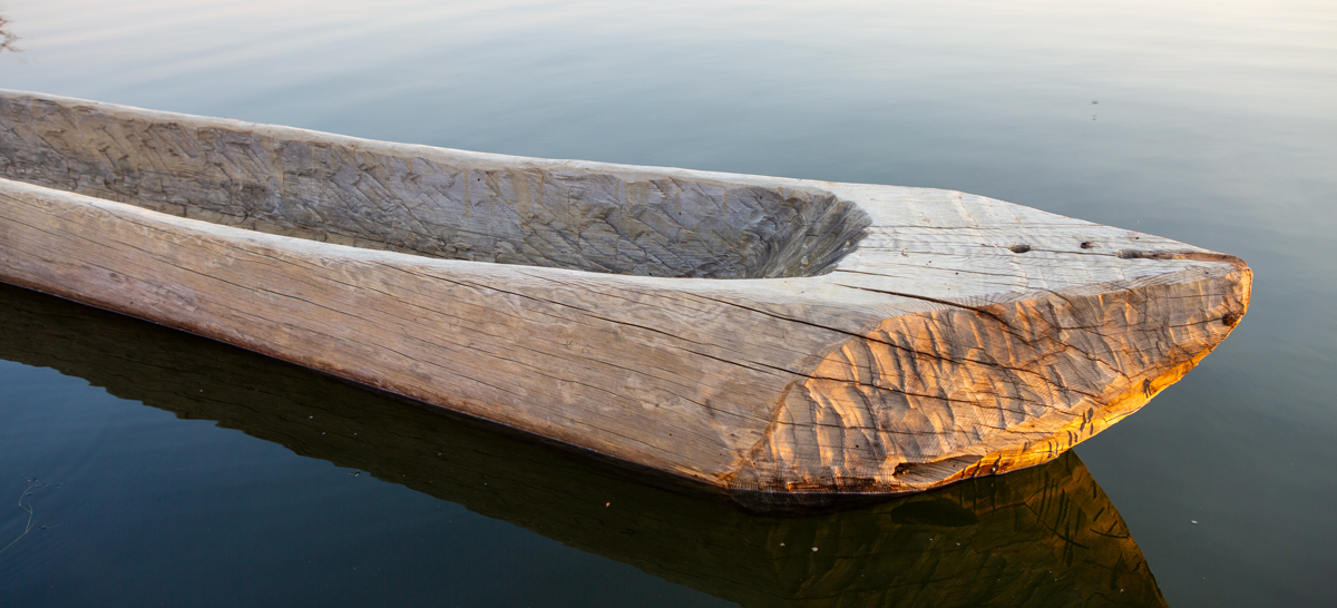 Front of a dugout canoe with several cracks
