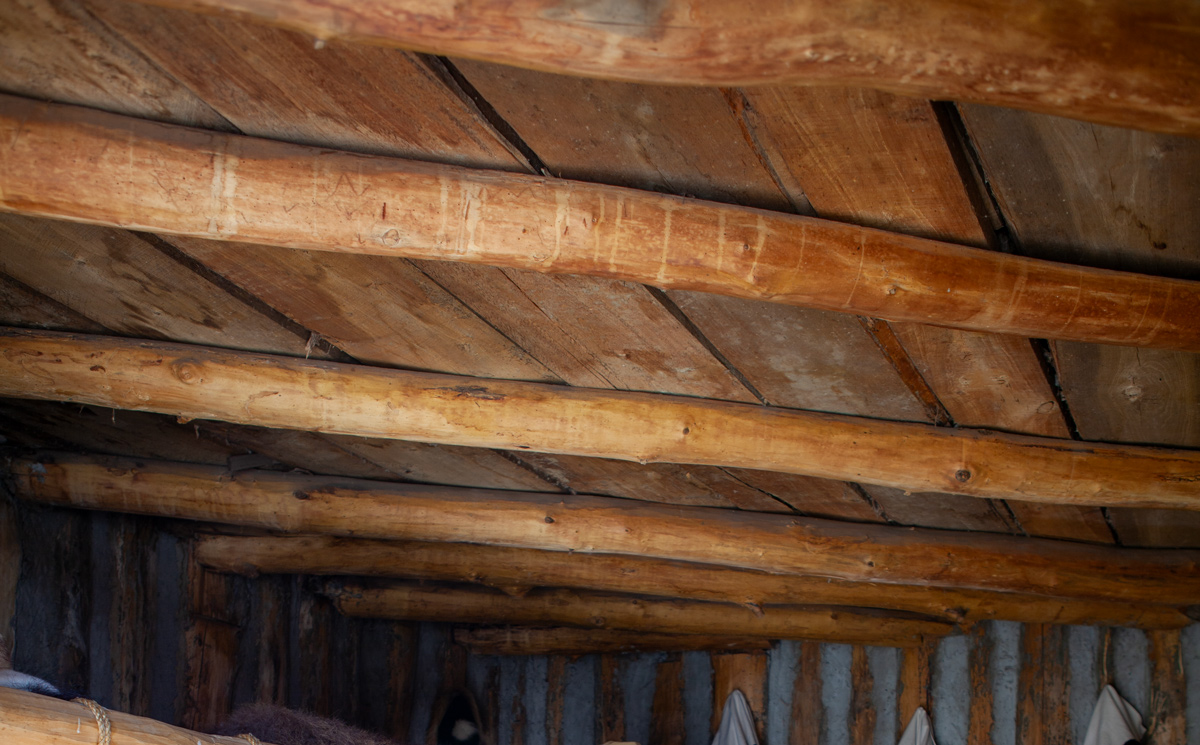 Rough hewn beams and plank ceiling