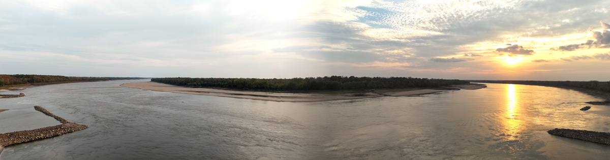 A large bend in the Mississippi River at sunset