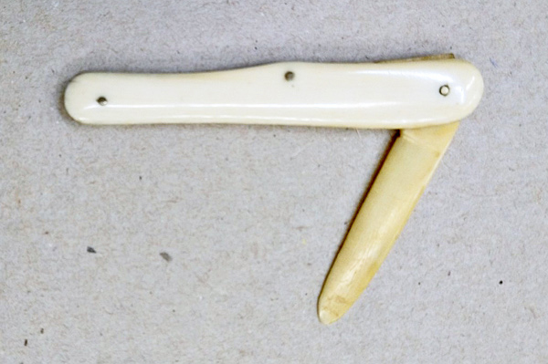 small folding knife made from ivory