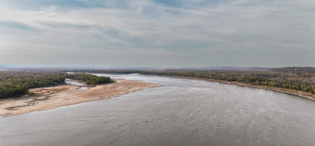 Wide Mississippi River among low hills