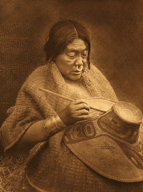 Coastal Indian women painting a woven hat