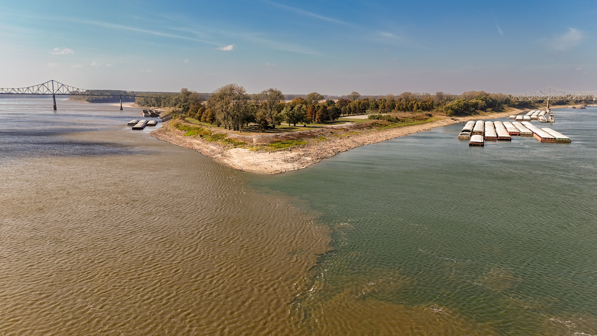 A narrow point of land separates two large rivers