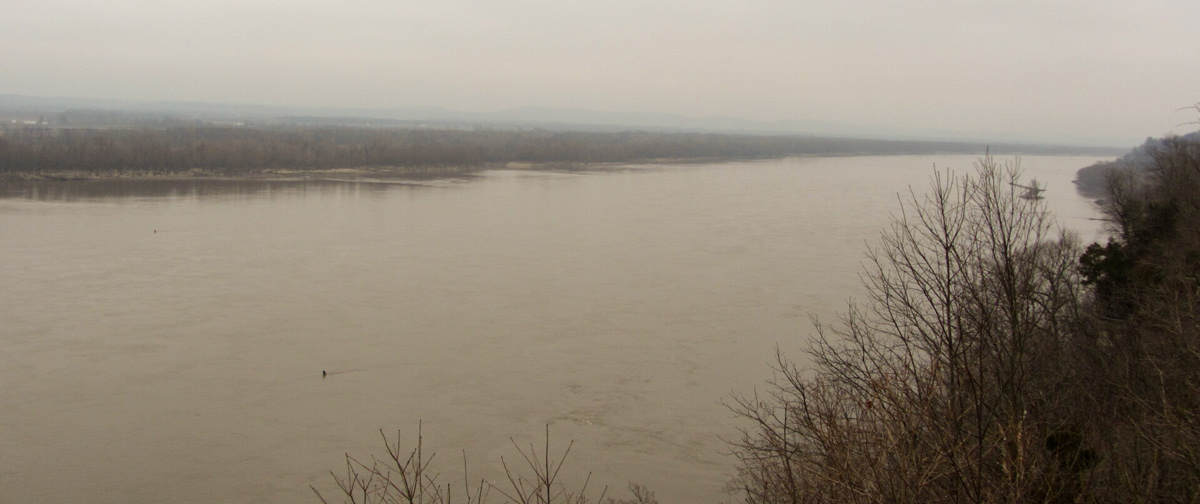 Wide Mississippi River among low hills